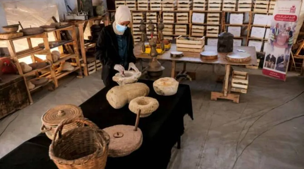 Palestinian curators working to restore ancient artifacts amid the ruins of war-devastated Gaza. (AFP)
