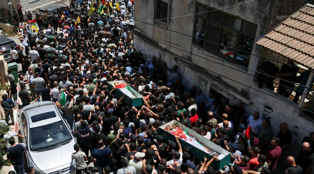 الجيش الإسرائيلي والمستوطنون يقتلون فلسطينييَن في هجوم على بلدة في رام الله