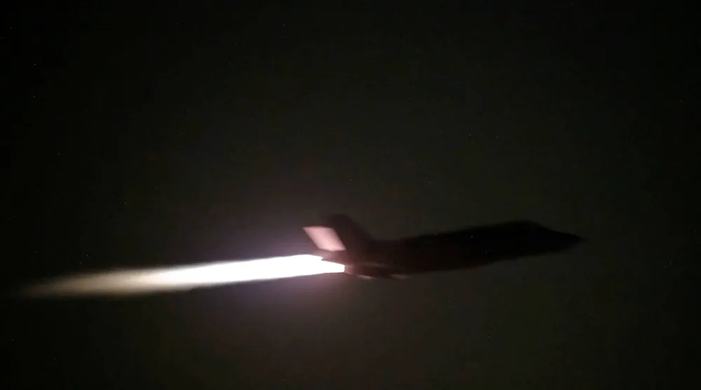 A US military aircraft flies at an unknown location, during what US Central Command (CENTCOM) says are strikes on Iran, in this screengrab taken from a handout video released on July 20, 2026. US Central Command/Handout via REUTERS
