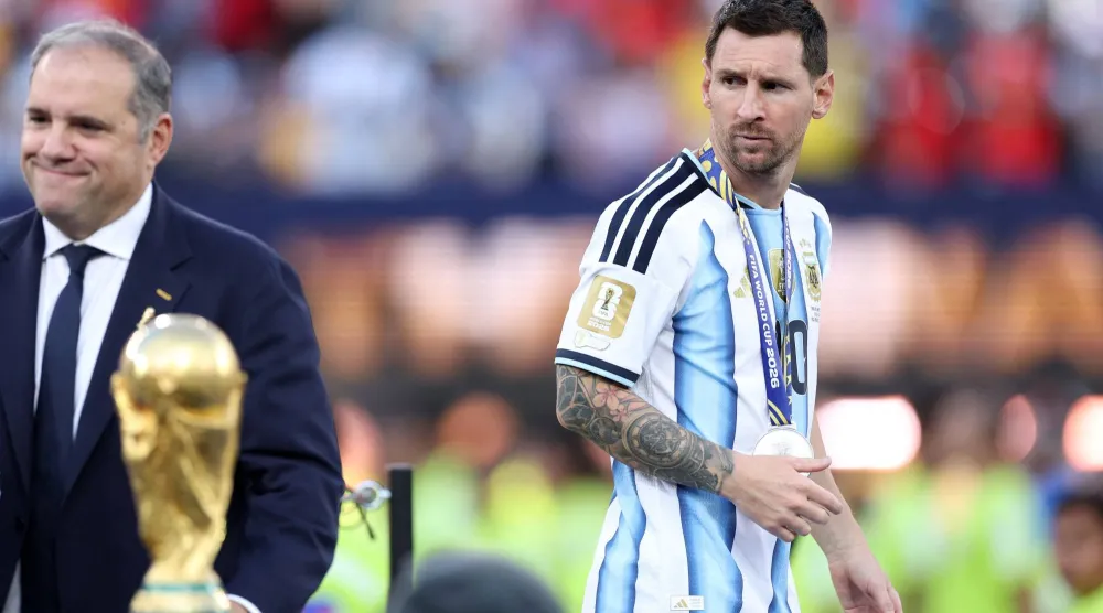Lionel Messi #10 of Argentina looks at the World Cup trophy after losing the FIFA World Cup 2026 Final match between Winner Spain and Argentina at New York New Jersey Stadium on July 19, 2026 in East Rutherford, New Jersey. (Getty Images/AFP)