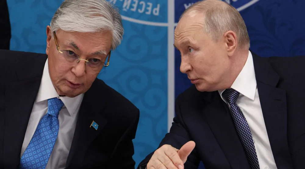  In this pool photograph distributed by the Russian state agency Sputnik, Russia's President Vladimir Putin (R) speaks to Kazakhstan's President Kassym-Jomart Tokayev as they attend the 22nd Russia-Kazakhstan Forum of Interregional Cooperation in Omsk on July 25, 2026. (AFP)