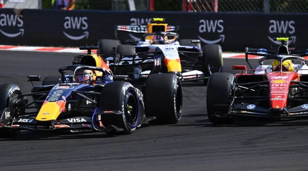 Red Bull driver Max Verstappen of Netherlands, Racing Bulls driver Liam Lawson of New Zealand and Ferrari driver Lewis Hamilton of Britain (L-R)in action during the Formula One Hungarian Grand Prix at the Hungaroring circuit in Mogyorod, Hungary, 26 July 2026. (EPA)