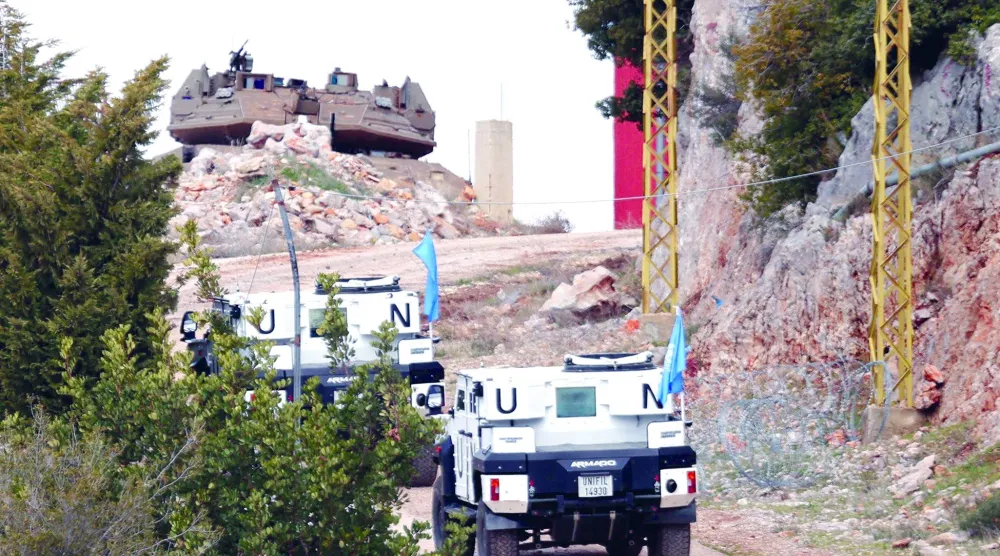 صورة ارشيفية لمركبات تابعة لقوات الـ"يونيفيل" قرب موقع للاحتلال الإسرائيلي بمنطقة كفرشوبا في أقصى جنوب شرقي لبنان (آ ف ب)   