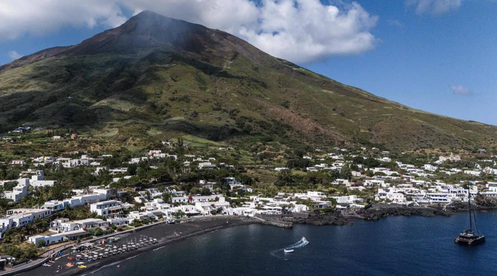 This aerial view shows the Stromboli Island, part of the Aeolian archipelago off Sicily, on July 8, 2026. (Photo by Marco BERTORELLO / AFP)