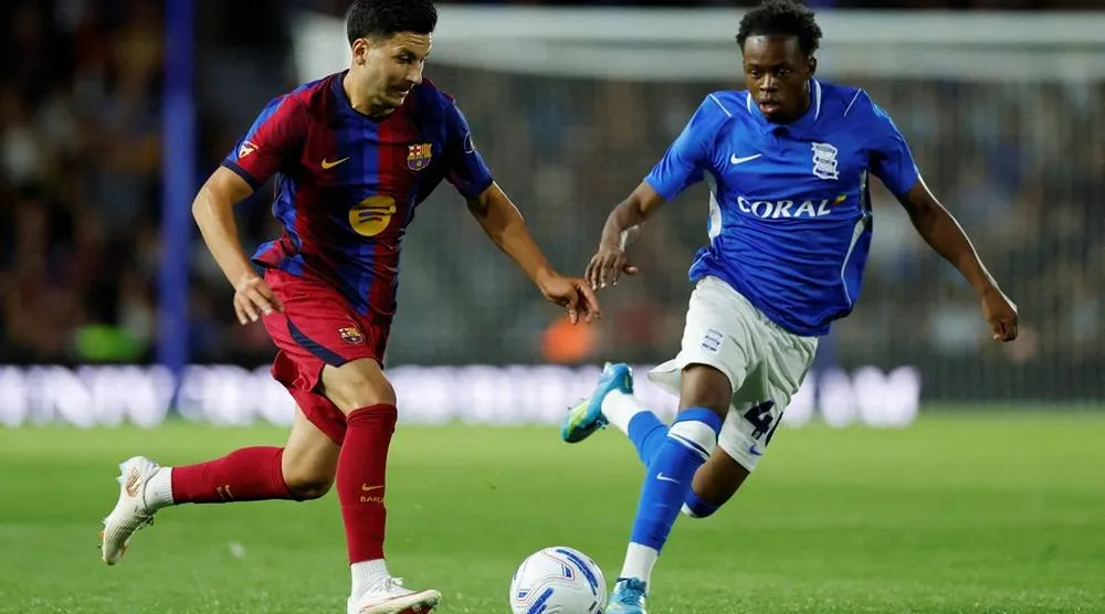 Football - Pre-Season Friendly - Birmingham City v FC Barcelona - St Andrew's - Knighthead Park, Birmingham, Britain - July 31, 2026 FC Barcelona's Roony Bardghji in action with Birmingham City's Menzi Mazw. (Reuters)