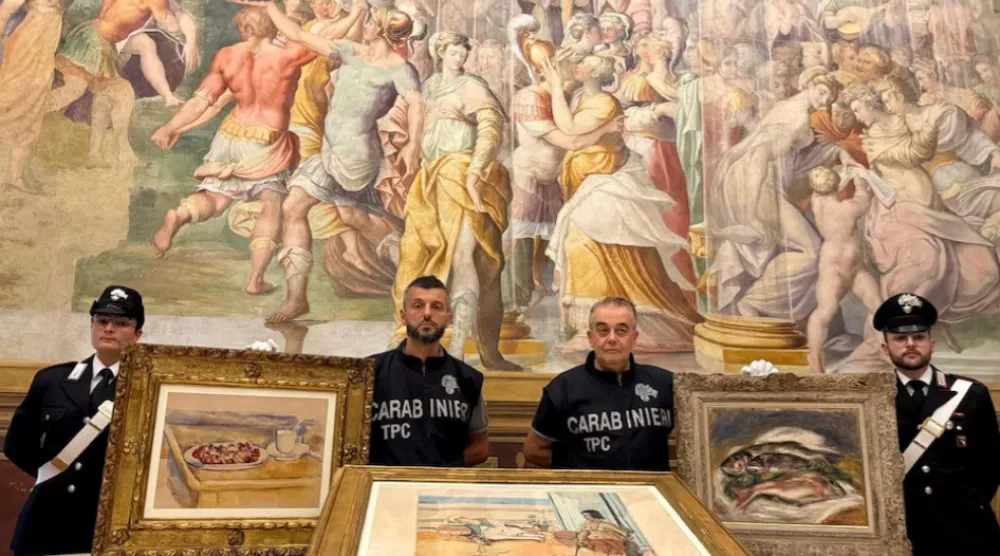 Carabinieri officers pose with three paintings by Paul Cezanne, Henri Matisse and Pierre-Auguste Renoir recovered after they were stolen from the Magnani Rocca Foundation in Mamiano, Italy, in this handout image released on August 14, 2026. Carabinieri/Handout via REUTERS 
