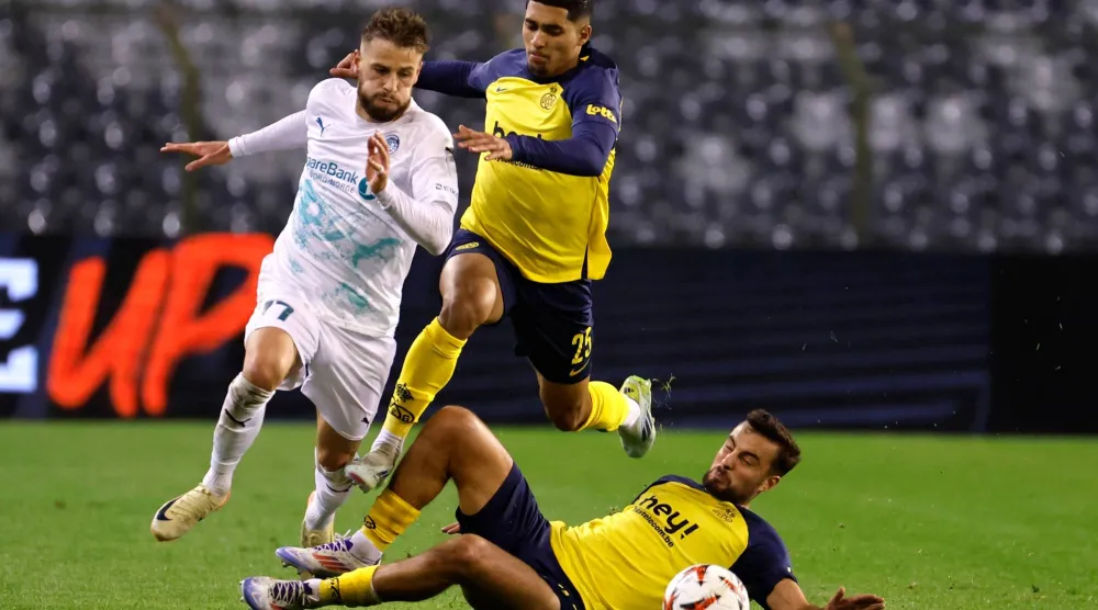 FILE - Union SG's Charles Vanhoutte, right, and Union SG's Anan Khalaili, center, fight for the ball against Glimt's Philip Zinckernagel during the Europa League opening phase soccer match between Union SG and Bodo/Glimt at the King Baudouin stadium in Brussels, on Oct. 3, 2024. (AP Photo/Geert Vanden Wijngaert, File)