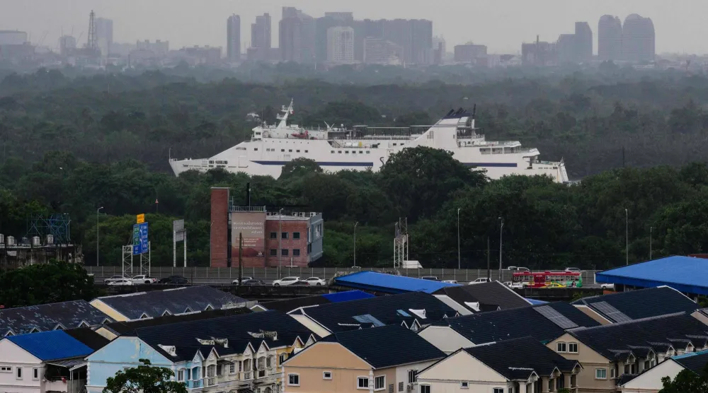 A ship that ferries passengers and vehicles during a 22-hour journey between Bangkok and the southern Thai island of Koh Samui, sails along the Chao Praya River in Bangkok on August 12, 2026. (Photo by ANTHONY WALLACE / AFP)
