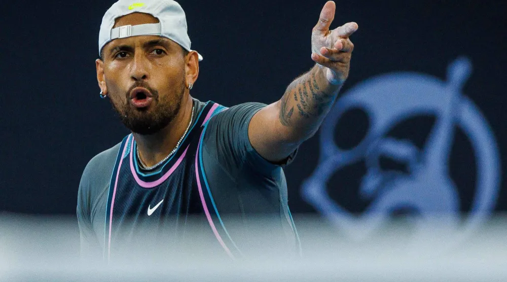 (FILES) Australia's Nick Kyrgios reacts after a point against France's Giovanni Mpetshi Perricard during their men's singles match at the Brisbane International tennis tournament in Brisbane on December 31, 2024. (Photo by Patrick HAMILTON / AFP)