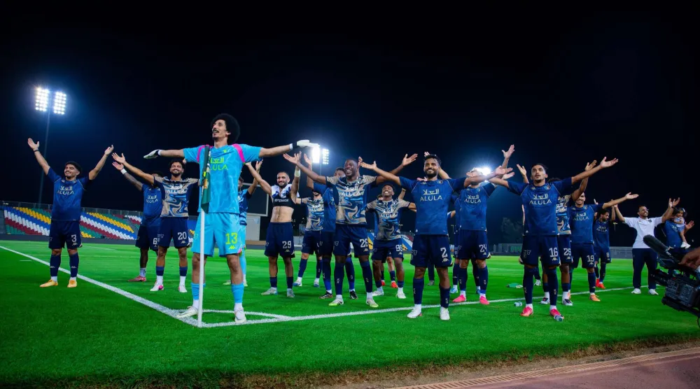 لاعبو العلا يحتفلون بالتأهل إلى ثمن نهائي كأس الملك (موقع النادي)