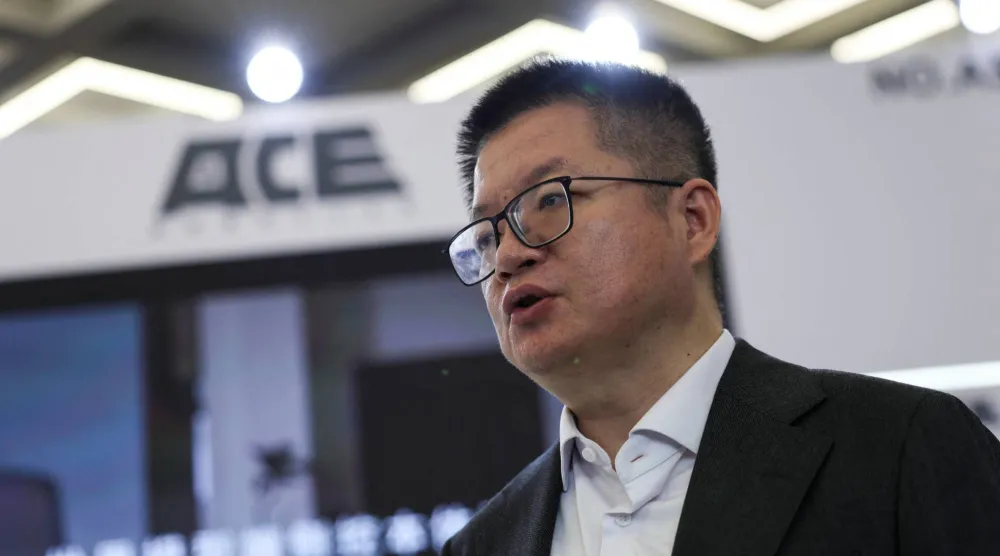 Wang Xiaogang, co-founder of SenseTime and chairman of ACE Robotics, speaks during an interview with Reuters at the booth of ACE Robotics, during the 2026 World Robot Conference, in Beijing, China, August 21, 2026. REUTERS/Tingshu Wang