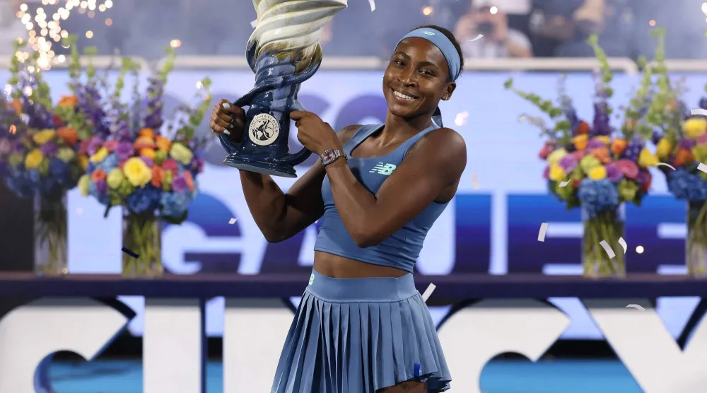 MASON, OHIO - AUGUST 23: Coco Gauff of the United States celebrates with the Rookwood Cup after defeating Jessica Pegula of the United Staes during the Women's Final on day twelve of the Cincinnati Open at the Lindner Family Tennis Center on August 23, 2026 in Mason, Ohio.   Matthew Stockman/Getty Images/AFP