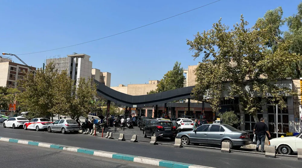 Drivers queue at a petrol station to refuel in Tehran, on August 25, 2026. (AFP)