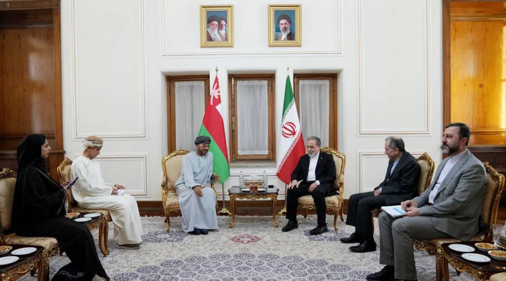 A handout picture provided by the Iranian Foreign Ministry Office, shows Iranian Foreign Minister Abbas Araghchi (top-R) and Omans' Foreign Minister Badr al-Busaidi (Top-L) meeting in Tehran on August 25, 2026. (Iranian Foreign Ministry Office / AFP)  