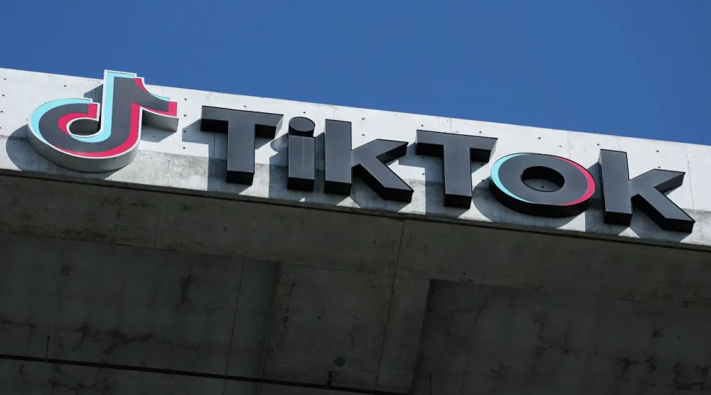 The TikTok logo is displayed on signage outside TikTok social media app company offices in Culver City, California on September 30, 2025. (AFP)