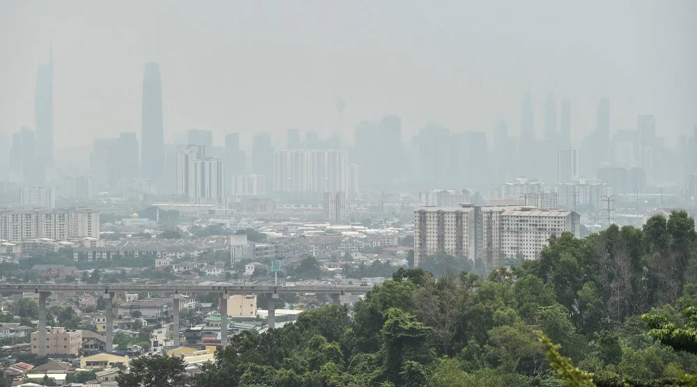 Haze shrouds the Kuala Lumpur skyline on August 26, 2026, amid high levels of air pollution from regional wildfires. (AFP)