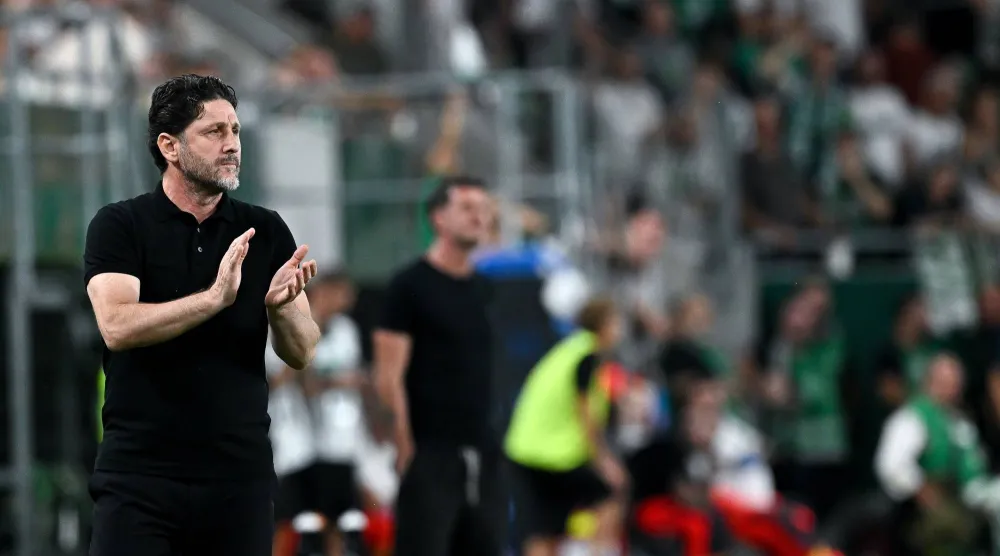 Head coach of Trabzonspor Fatih Tekke watches from the touchline during the UEFA Europa League play-offs second leg match between Ferencvaros and Trabzonspor in Budapest, Hungary, 27 August 2026. (EPA)