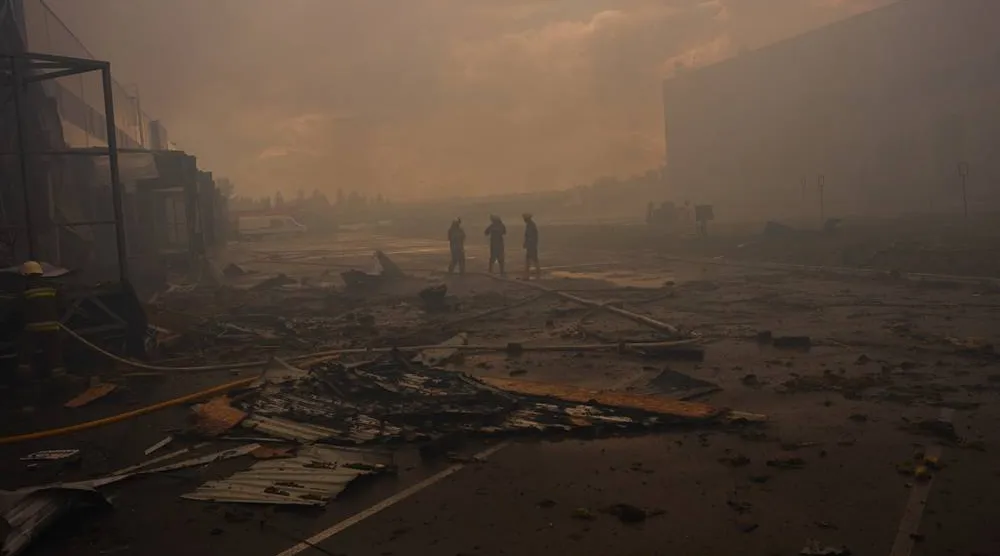 Firefighters walk among debris at a destroyed pharmaceutical warehouse after Russian drone attacks on the outskirts of Kyiv, Ukraine, Thursday, Sept. 3, 2026. (AP)