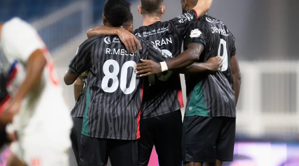 لاعبو الاتفاق يحتفلون بهدف الفوز على أبها (موقع النادي)