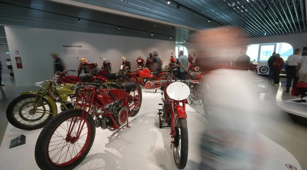 Riders and visitors enjoy Guzzi motorcycles displayed at the museum during the Guzzi opening inaugurating its completely redeveloped historic factory and new museum as the motorcycle maker celebrates its 105th anniversary, in Mandello del Lario, Thursday, Sept. 3, 2026. (AP) 