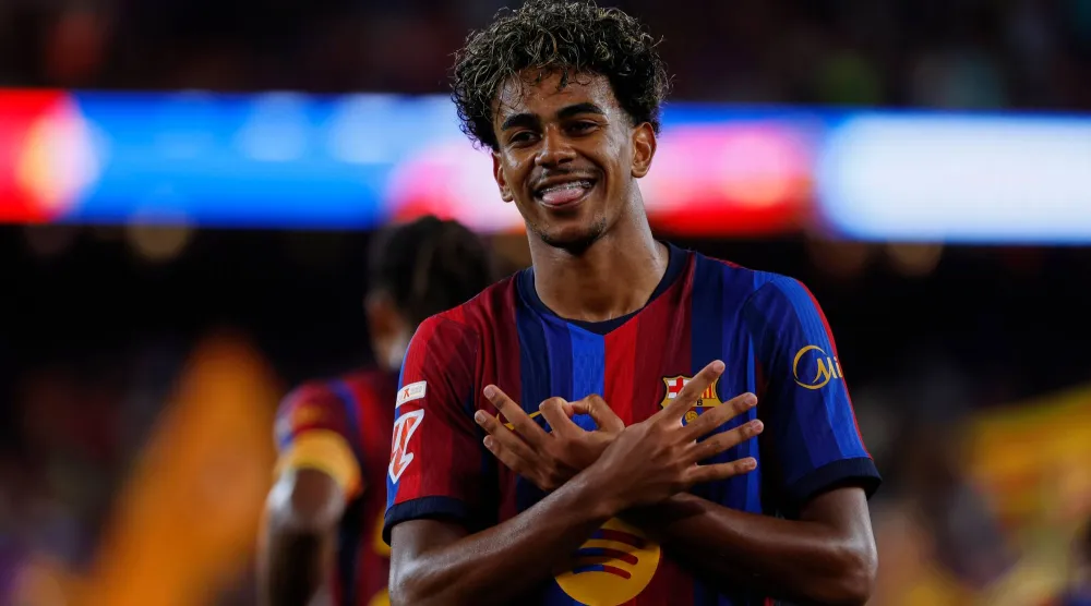 Barcelona's Lamine Yamal celebrates after scoring his side's fifth goal during a Spanish La Liga match between Barcelona and Rayo Vallecano in Barcelona, Spain, Monday, Aug. 31, 2026. (AP) 