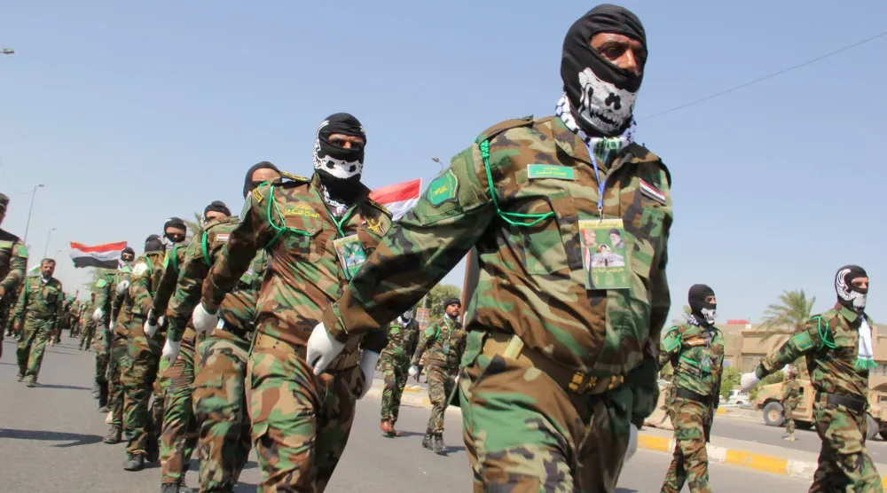 عناصر من «الحشد الشعبي» يشاركون في عرض عسكري ببغداد (أرشيفية - غيتي)