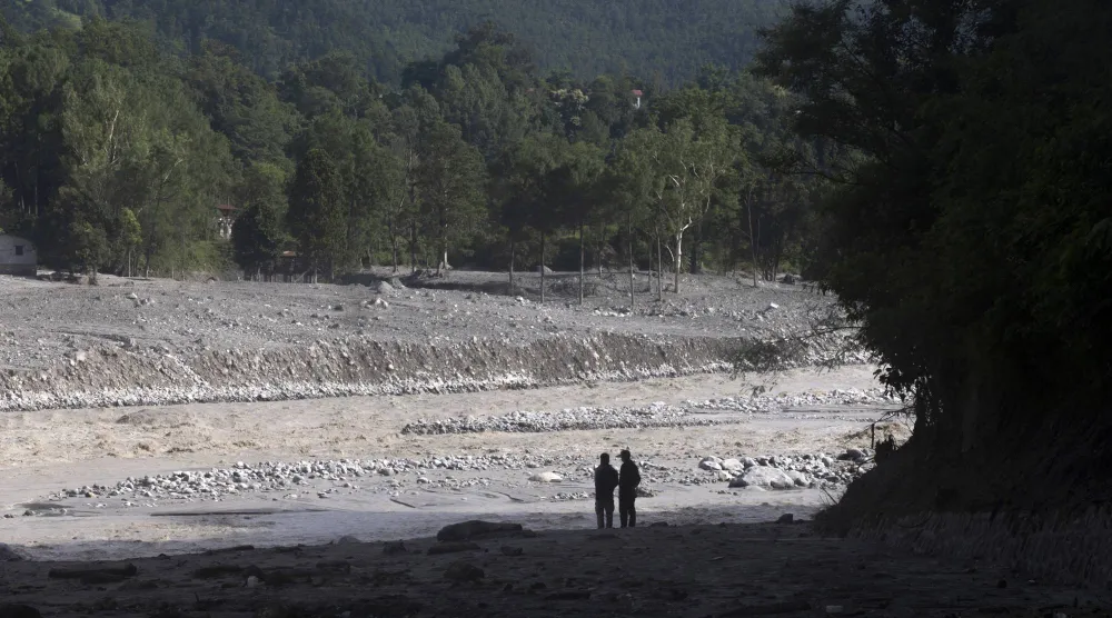 People walk through a flood-affected area in Devighat, Nuwakot district, Nepal, 05 September 2026. EPA/NARENDRA SHRSTHA