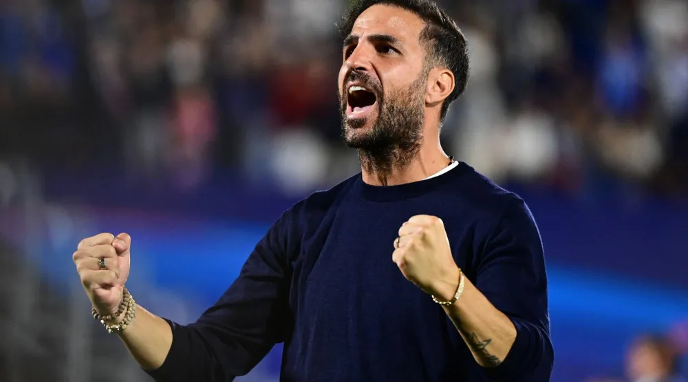 Como's Spanish coach Cesc Fabregas celebrates the victory of his team at the end of the UEFA Champions League, league phase, matchday 1, football match between Como 1907 and RB Leipzig at the Giuseppe Sinigaglia stadium in Como, on September 10, 2026. (Photo by PIERO CRUCIATTI / AFP)