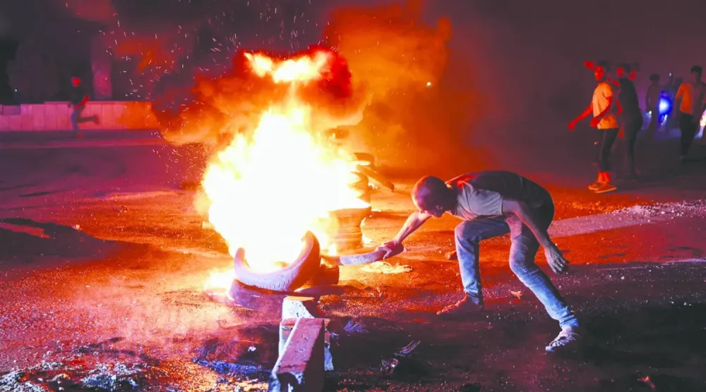 Halep'te artan yakıt fiyatlarına yönelik protestolardan, (Reuters)