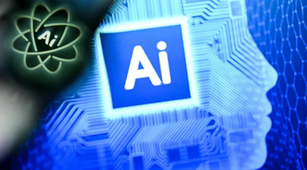 الحرفان «AI» (اختصاراً لمصطلح الذكاء الاصطناعي) على شاشة حاسوب محمول (أ.ف.ب)