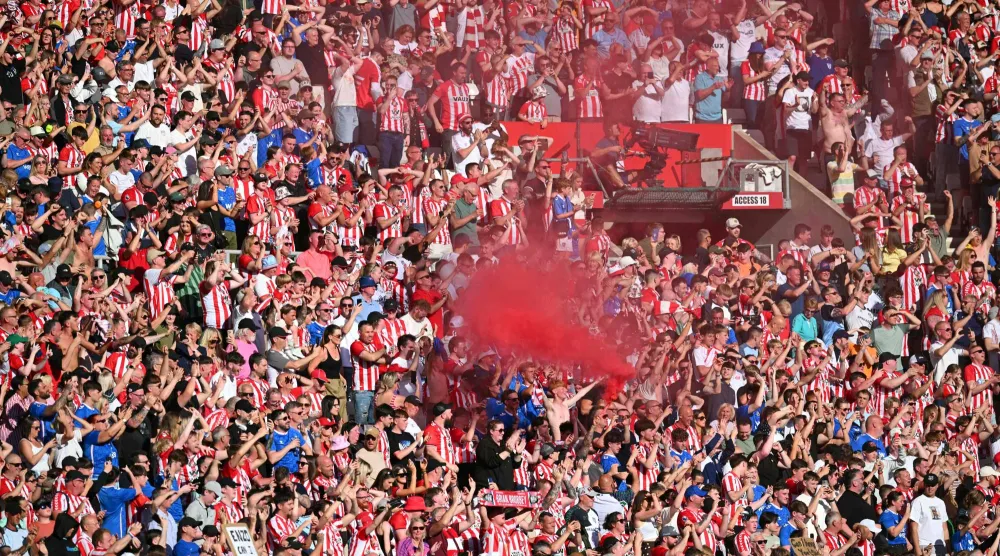 Sunderland fans celebrate after the English Premier League football match between Sunderland and Chelsea at the Stadium of Light in Sunderland in north-east England on May 24, 2026. (AFP)