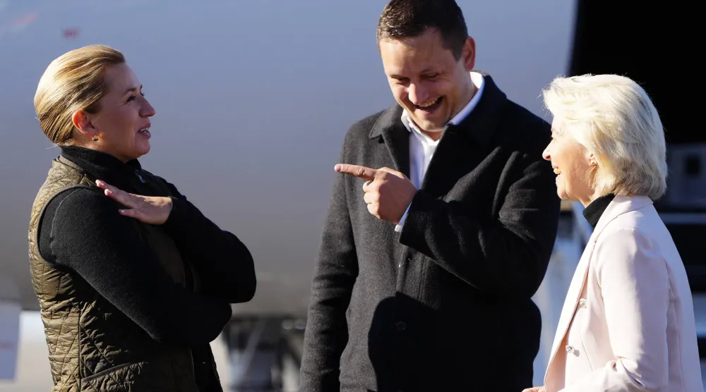 Greenland's Prime Minister Jens Frederik Nielsen and Danish Prime Minister Mette Frederiksen welcome European Commission President Ursula von der Leyen in Nuuk on Sunday (AFP)