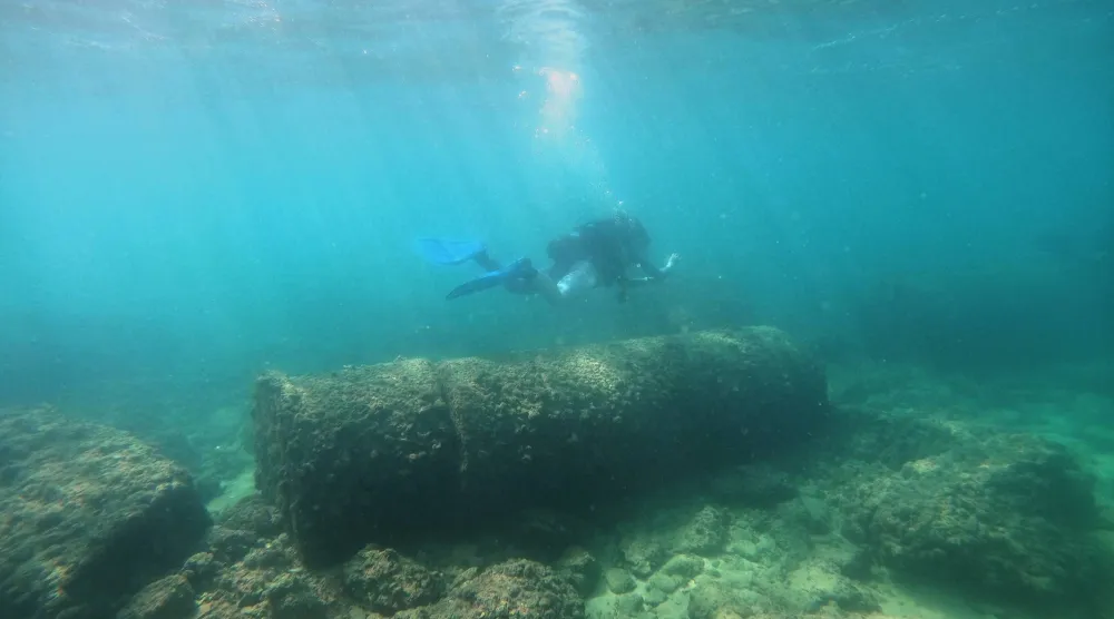 A diver passes above Roman-era columns at an archaeological site near the coast in the southern port city of Tyre, Lebanon, Thursday, Sept. 17, 2026. (AP Photo/Bilal Hussein)
