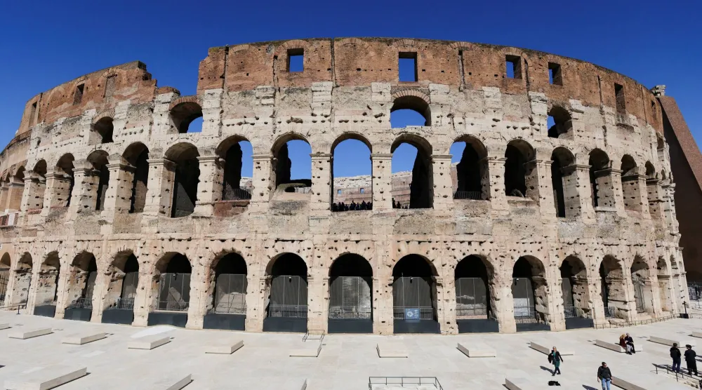 FILE PHOTO: People walk across restored southern ambulatory areas of the Colosseum, in Rome, Italy, March 17, 2026. REUTERS/Yara Nardi/File Photo