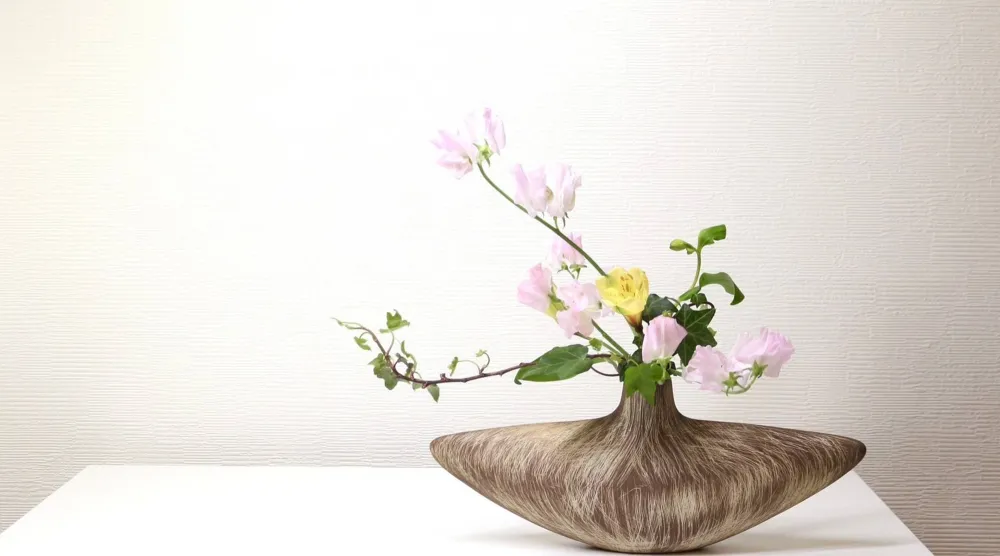 This photo released by Hiroyuki Okada shows a free-style Ikenobo ikebana arrangement in Tokyo on March 11, 2026. (Hiroyuki Okada via AP)