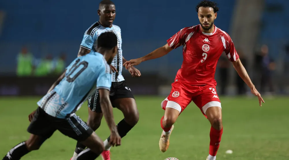 Tunisia's Montassar Talibi (R) fights for the ball with player of Botswana's Thero Setsile (L) during the CAF Africa Cup of Nations 2027 qualifying Group H match between Tunisia and Botswana in Tunis, Tunisia, 28 September 2026. (EPA) 