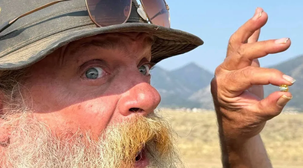 This photo provided by Jack Pearadin shows Brian Busse on Aug. 9, 2026, in Buena Vista, Colo., holding a 6-carat diamond found by Pearadin and Michael Schumacher. (Jack Pearadin via AP)
