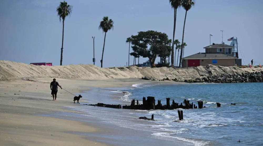 Sand berms have been built along beaches in Southern California in anticipation of storms hitting the area. Patrick T. Fallon / AFP
