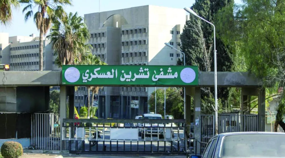 مدخل مستشفى تشرين العسكري قبل إعادة تسميته «مشفى دمشق العسكري» (أ.ف.ب)