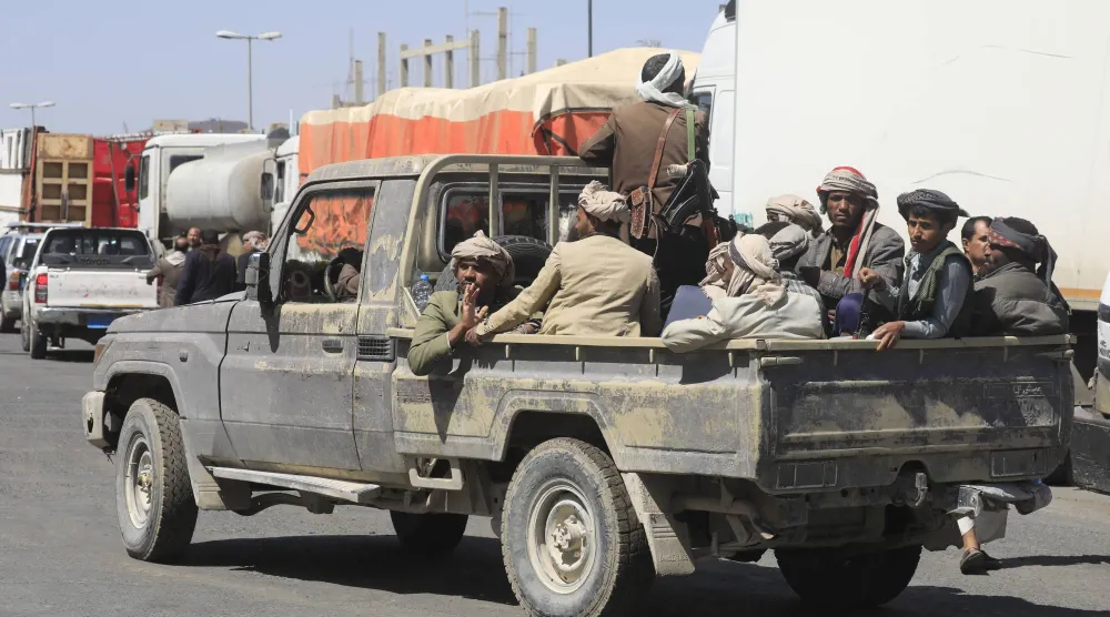 Houthi fighters ride in a pickup truck on a street, in Sanaa, Yemen, 07 October 2026. (EPA)