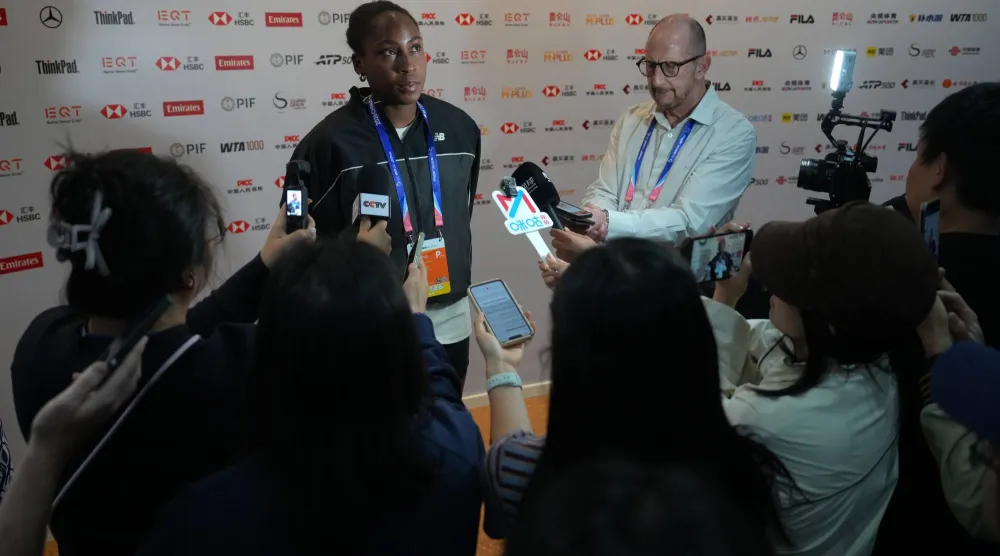 Coco Gauff, of the United States, pauses during a press conference following her loss to Elise Mertens of Belgium in the fourth round of the women's singles match at the China Open tennis tournament in Beijing, Wednesday, Oct. 7, 2026. (AP Photo/Andy Wong)