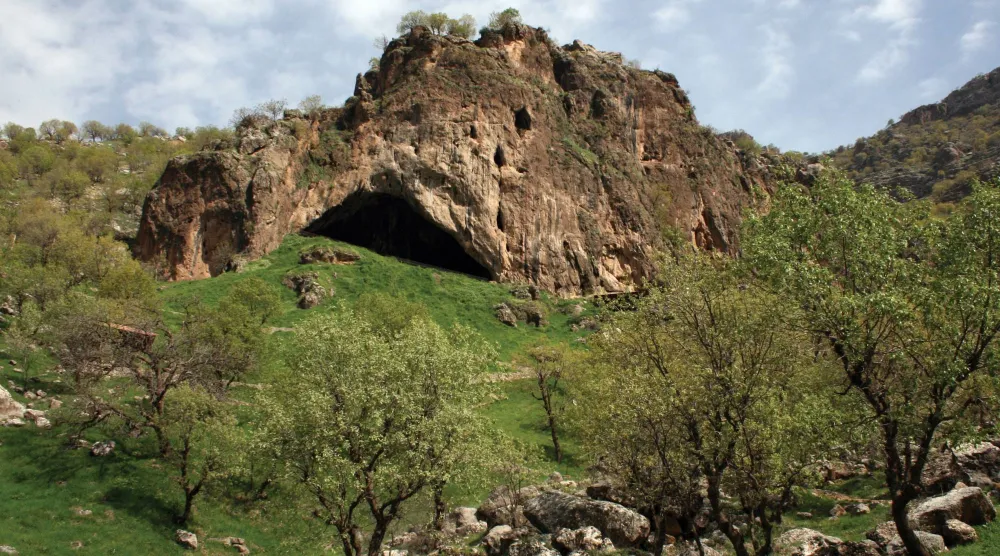 The entrance to Shanidar Cave in Iraq's Kurdistan region, a site of important Neanderthal remains, is seen in an undated photograph released on October 15, 2026. Prof Graeme Barker/Handout via REUTERS