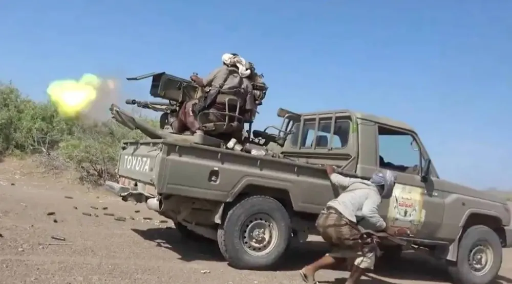 Fighters loyal to Yemen’s government on one of the front lines against the Houthis (AP)