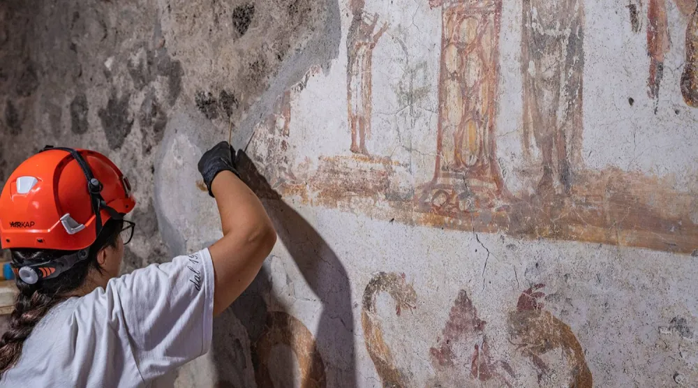  In this undated handout photo provided on Tuesday, Oct. 20, 2026, by the Pompeii Archaeological Park, restorers work inside the House of Marcus Fabius Rufus in Pompeii, near Naples, Italy. (Silvia Vacca/ Pompeii Archaeological Park via AP) 