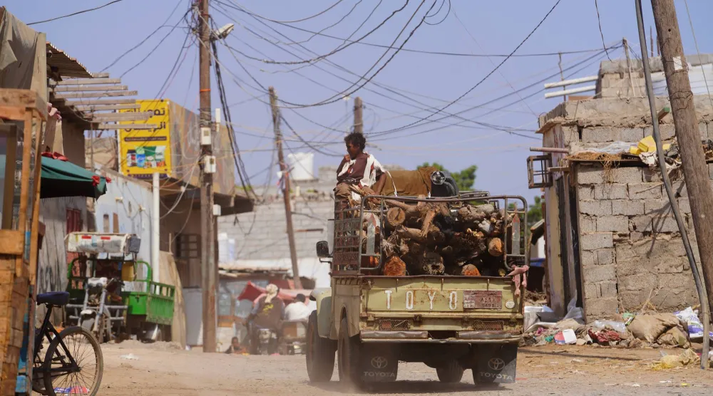 A truck loaded with firewood drives through the Al-Basateen neighborhood in Aden, Yemen, Tuesday, Oct. 13, 2026. (AP)