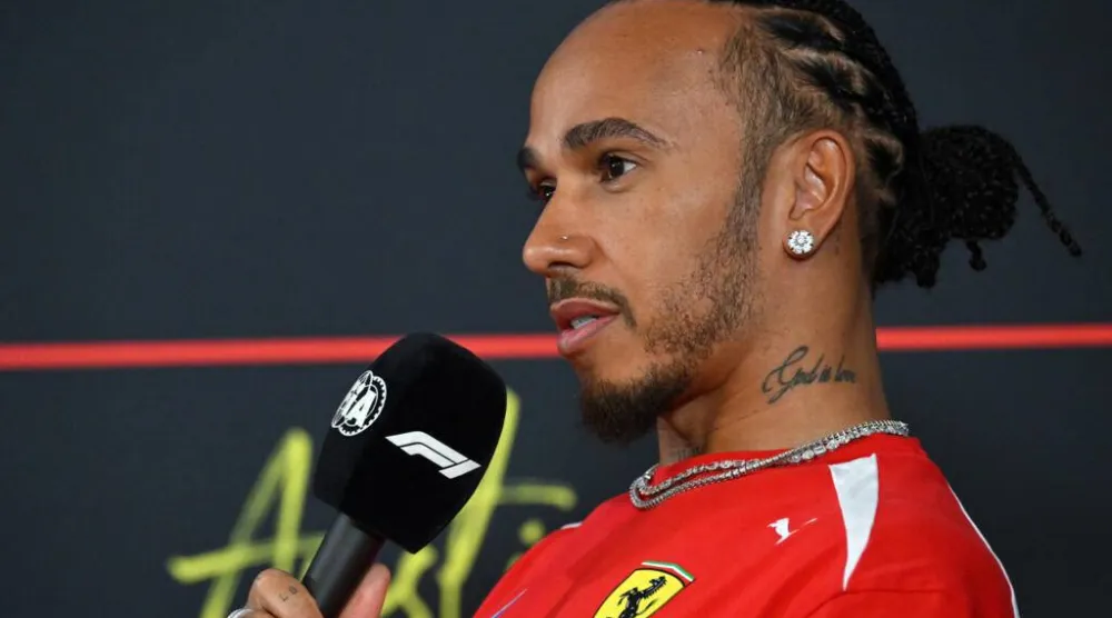 Ferrari's Lewis Hamilton is looking to 'punch out good results' over the next year. ANGELA WEISS / AFP
