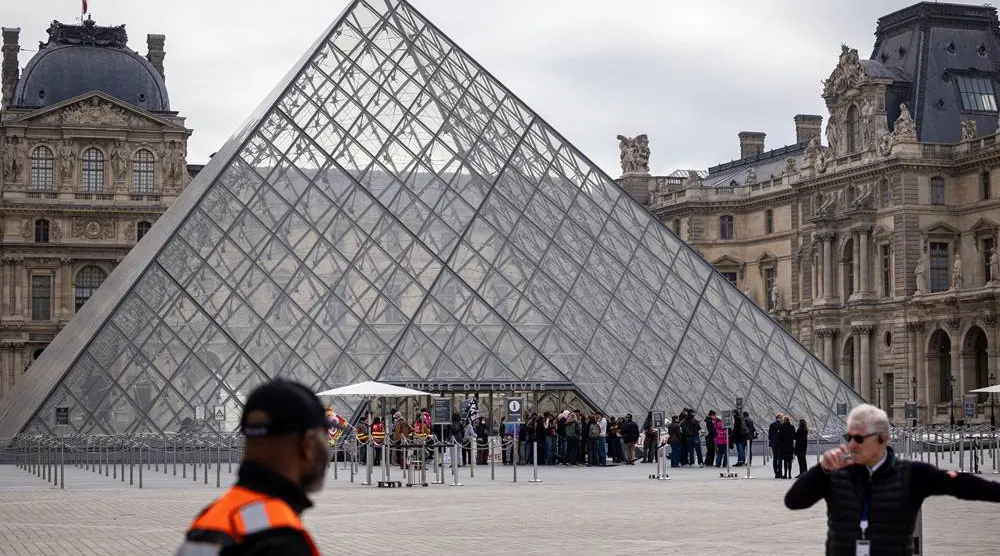 Visitors wait outside as protesters block the entrance to the Louvre Museum to express their support for the high school students' movement in Paris, France, 19 October 2026, two days after demonstrations and riots took place alongside nationwide cost-of-living protests. (EPA)