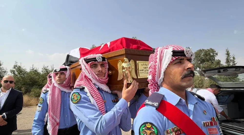 جانب من تشييع ضحايا الكنيسة الأحد (مديرية الأمن العام بالأردن)
