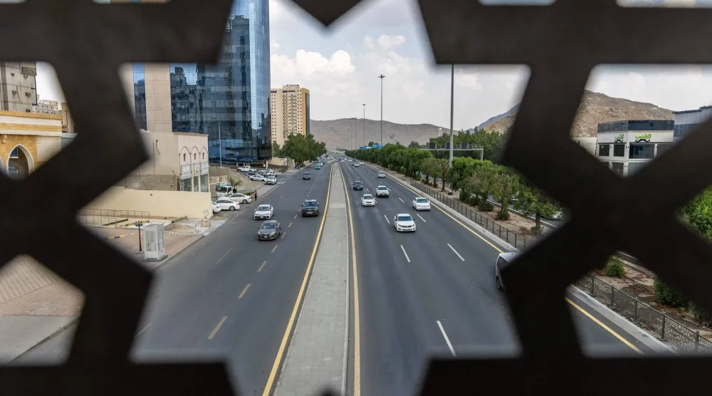 Vehicles drive along a road in Makkah on October 25, 2026. (AFP)