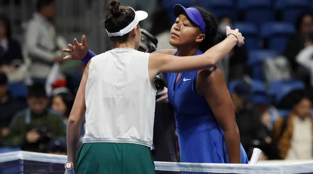 Tennis - WTA 500 - Pan Pacific Open - Ariake Coliseum, Tokyo, Japan - October 29, 2026 Slovakia's Mia Pohankova embraces Japan's Naomi Osaka after winning her round of 16 match REUTERS/Kim Kyung-Hoon